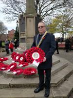 Prestwick War Memorial. Prestwick Rotary President Stephen Cooper laying a wreath and Rotarians and friends show their respect.